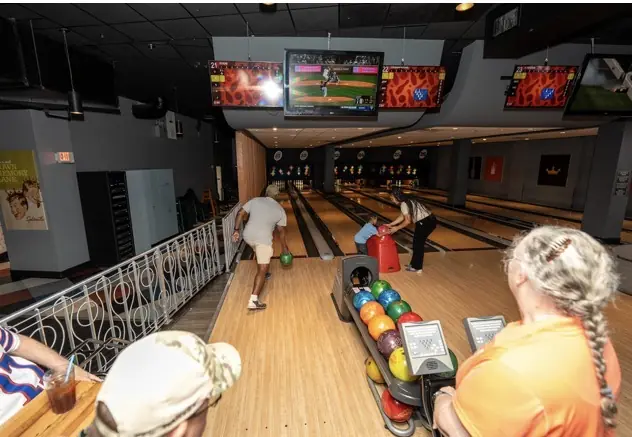 DAV members, families, and friends enjoy an Orlando bowling outing.