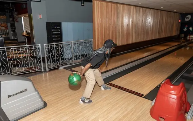 DAV members, families, and friends enjoy an Orlando bowling outing.