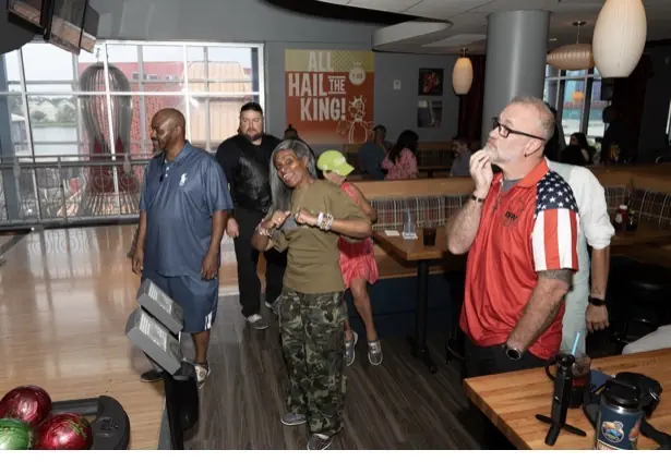 DAV members, families, and friends enjoy an Orlando bowling outing.