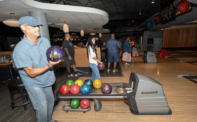 DAV members, families, and friends enjoy an Orlando bowling outing.