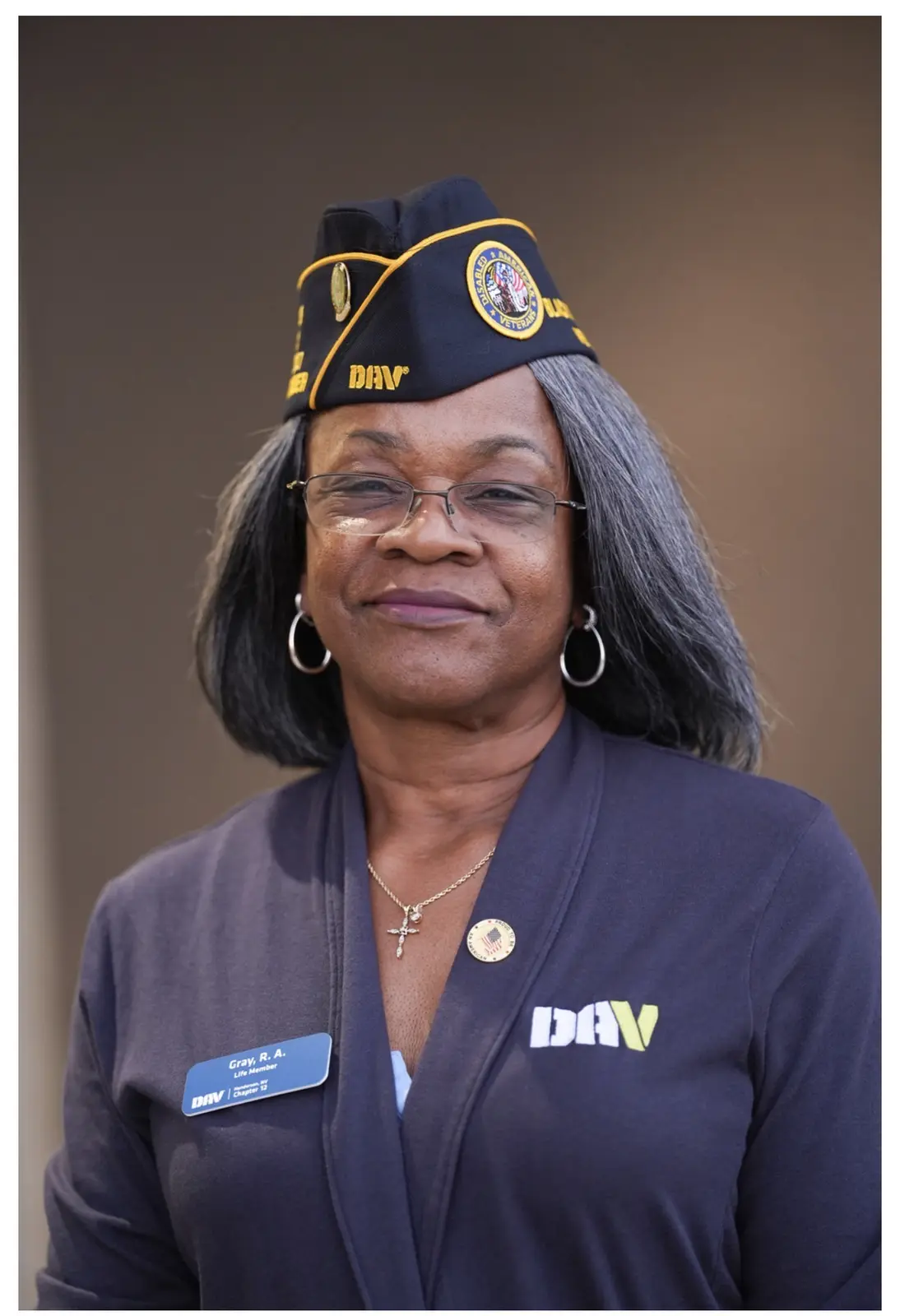 Portrait of Renee Gray in her DAV garrison cap and navy DAV jacket.