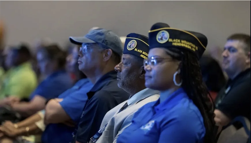 DAV members in Black Mountain Henderson chapter caps listening during a session at the DAV National Convention in Orlando